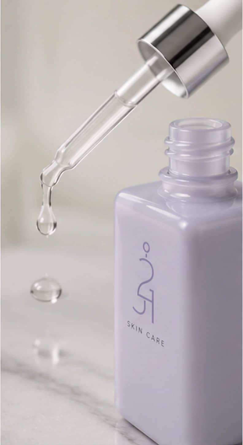 A drop falling from the HALO dropper into the open bottle.